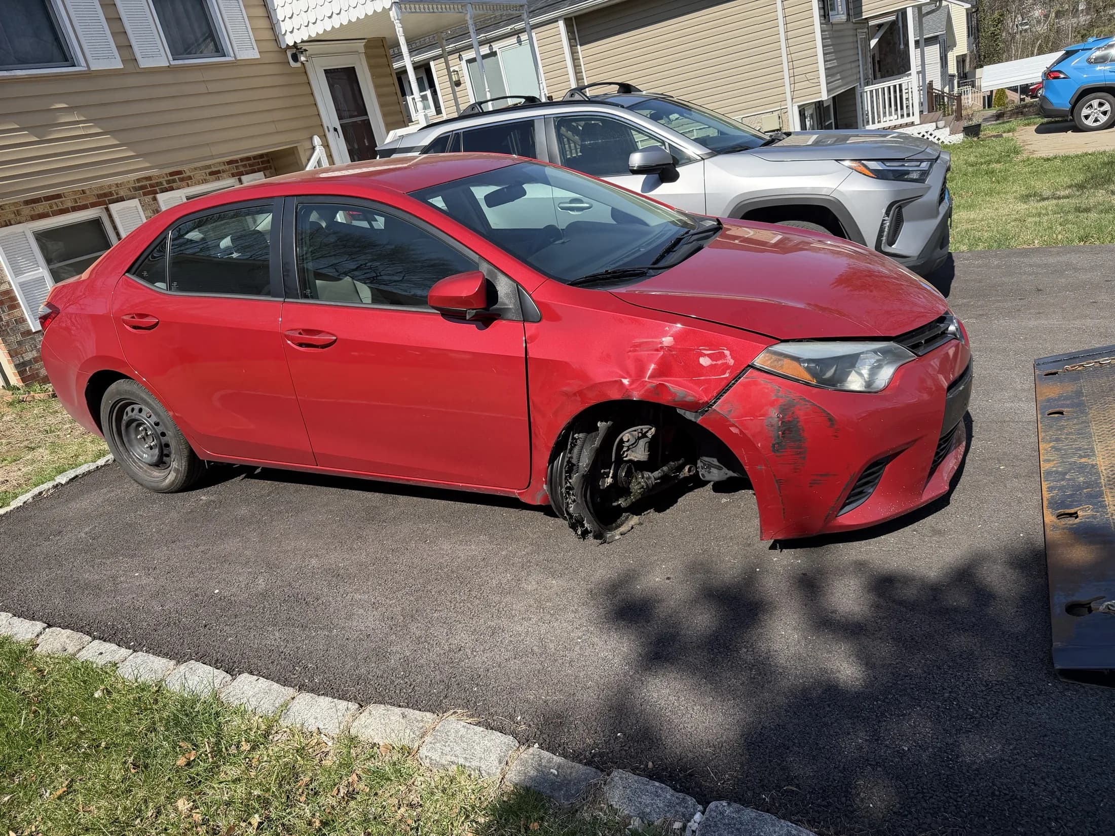 Vehicle with wheel damage ready for roadside tire help