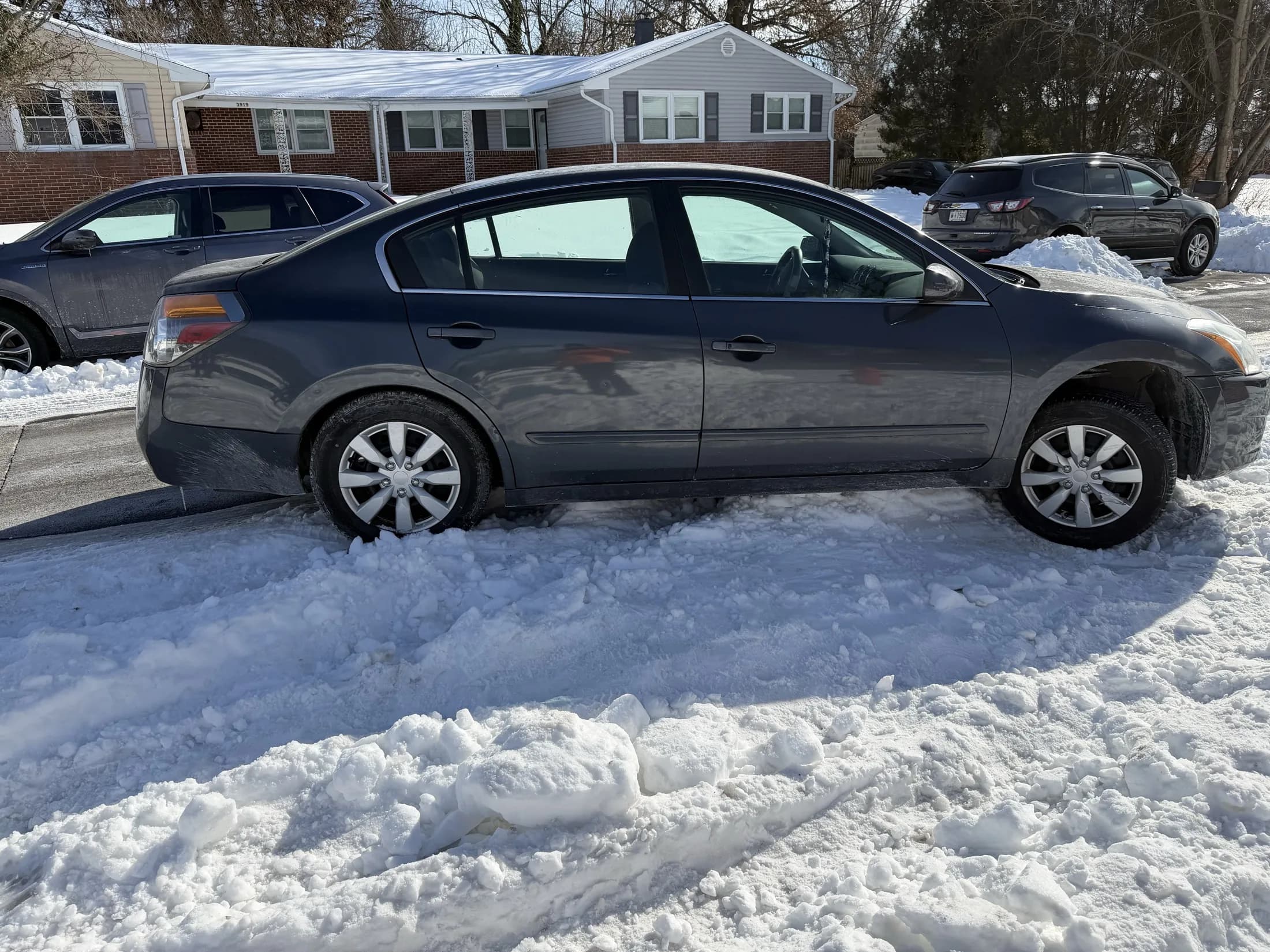 Vehicle stuck in snow before roadside recovery